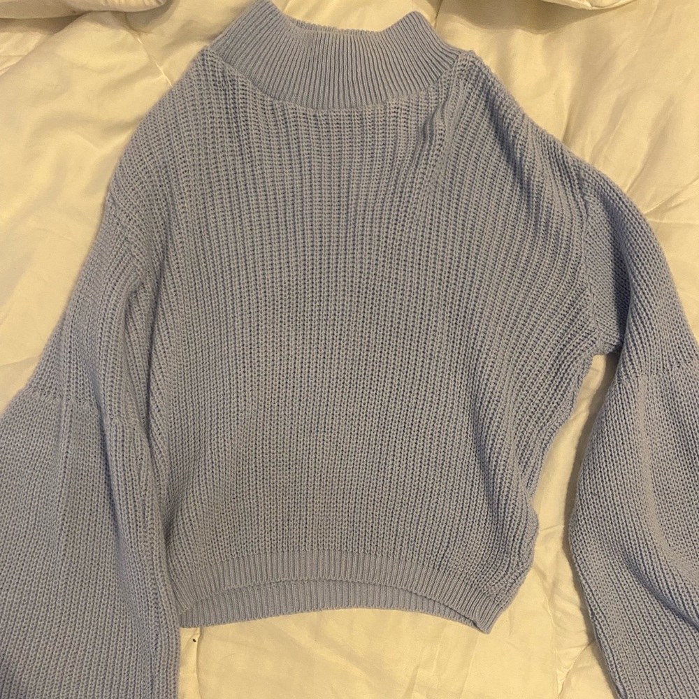 Blue turtle neck sweater with flare sleeves
